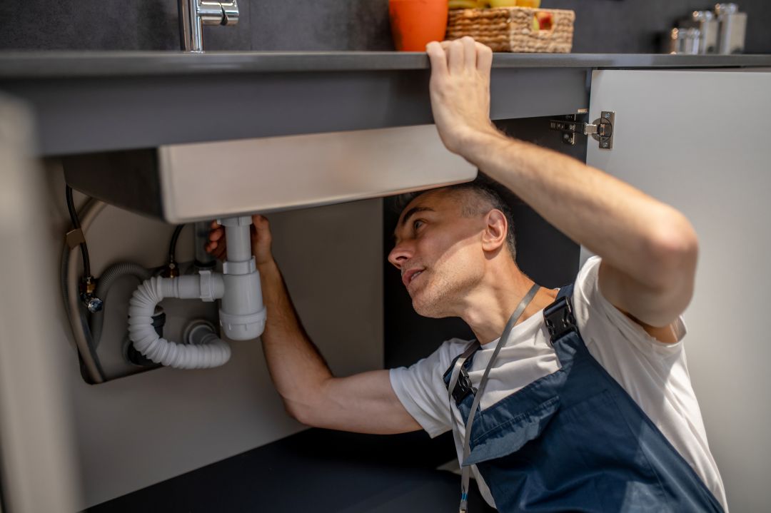 Plumber repairing leaks and burst pipes